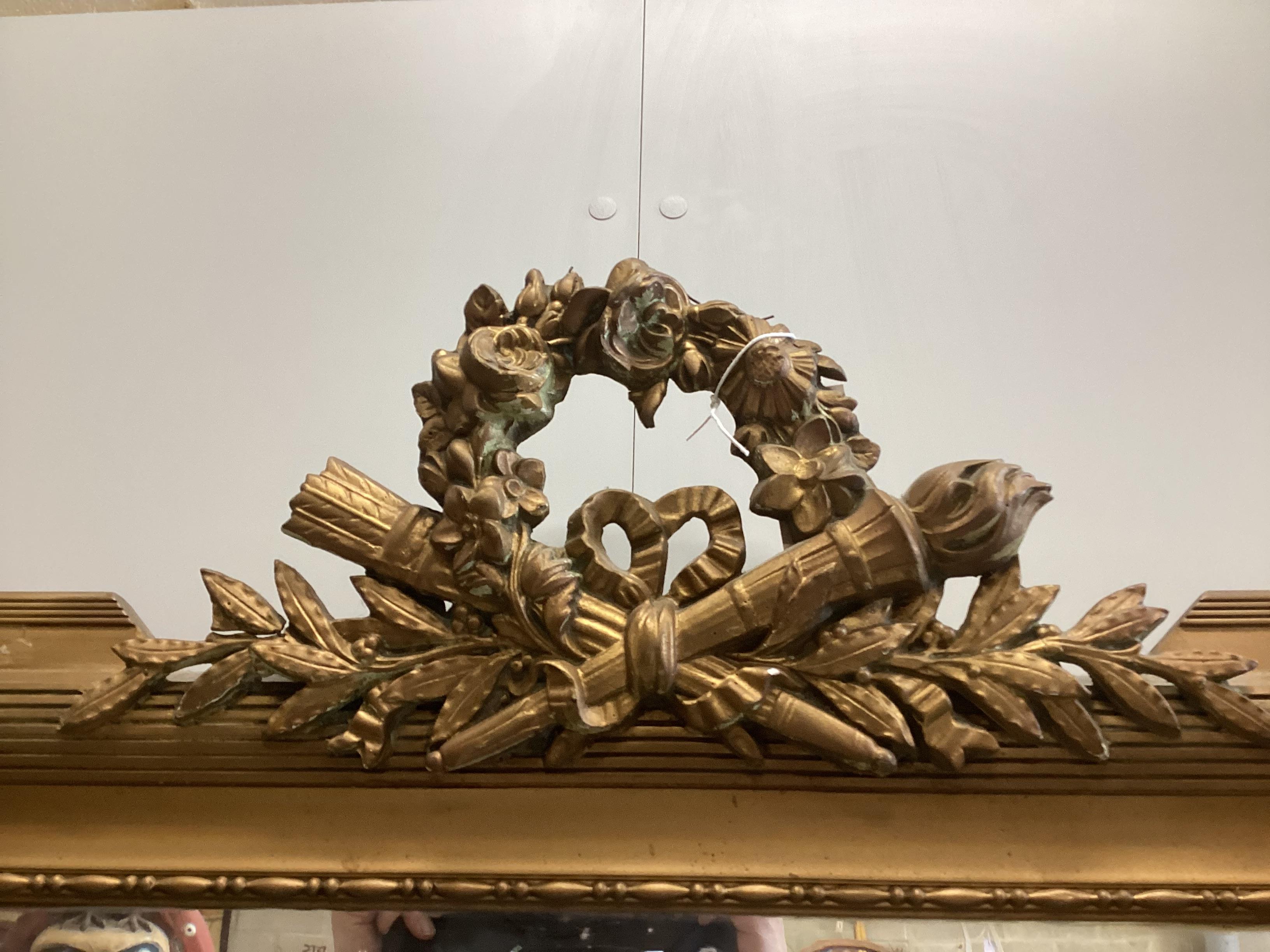 An early 20th century French giltwood and composition wall mirror, width 78cm, height 140cm